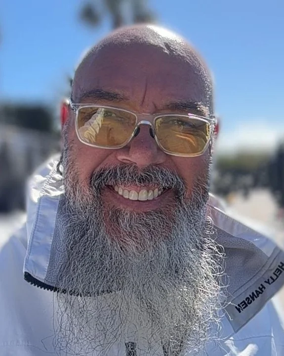 Bernado, skipper of Wu Wei, smiling at the marina